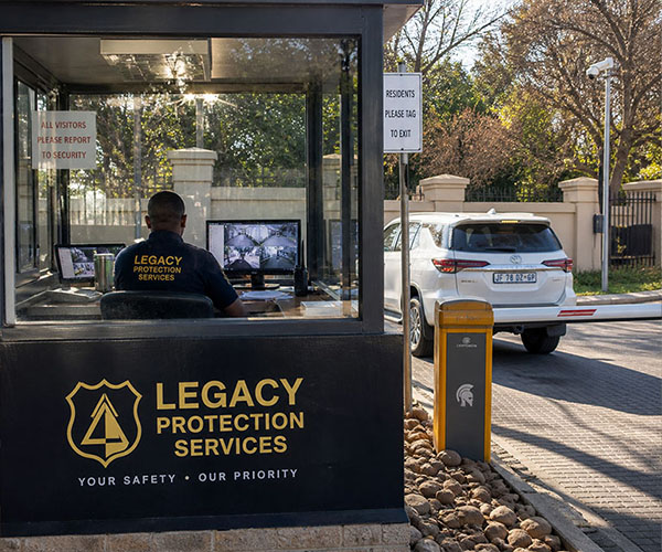 Legacy Protection Services security professional monitoring access control at an industrial or critical facility